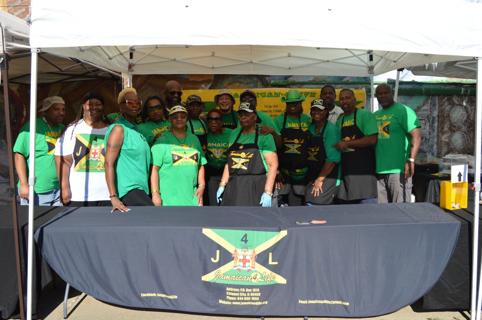 Group photo at Jamaican cultural event booth.