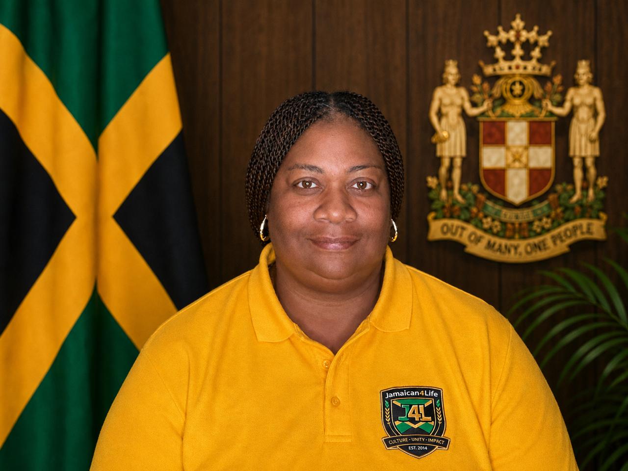 Woman in yellow shirt with Jamaican flag.