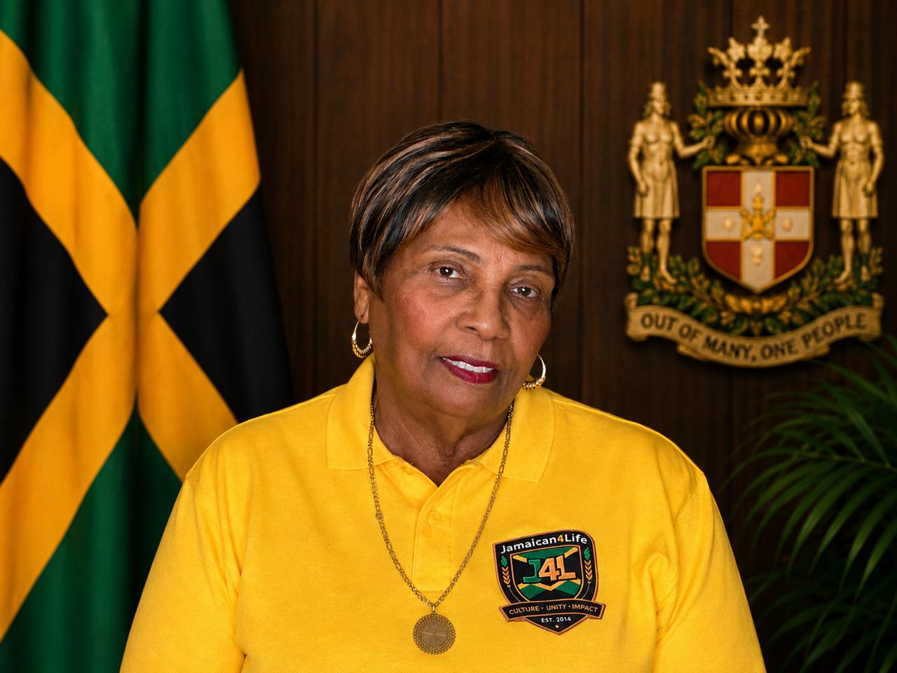 Woman in yellow shirt with Jamaican flag.