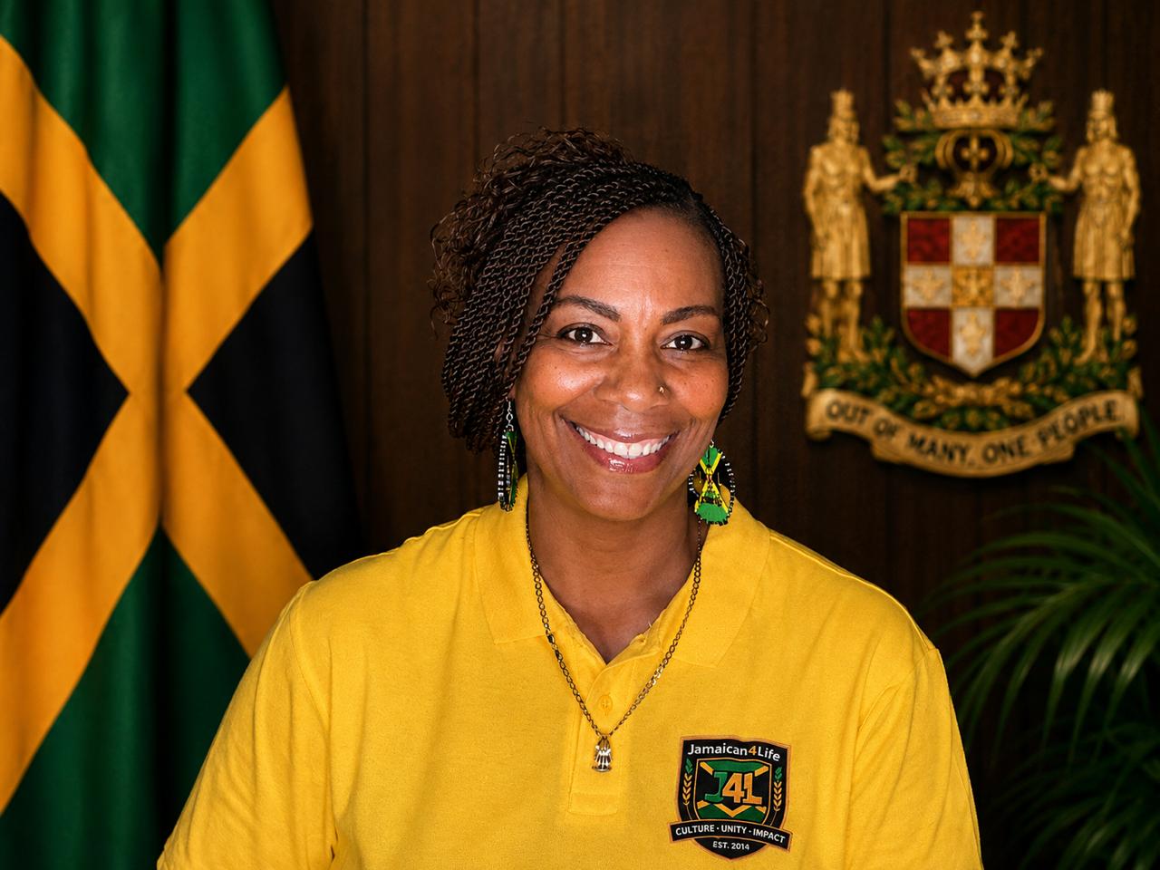 Smiling woman in yellow shirt, Jamaican flag.