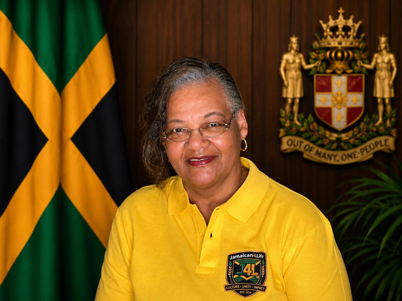 Woman in yellow shirt, Jamaican flag background.