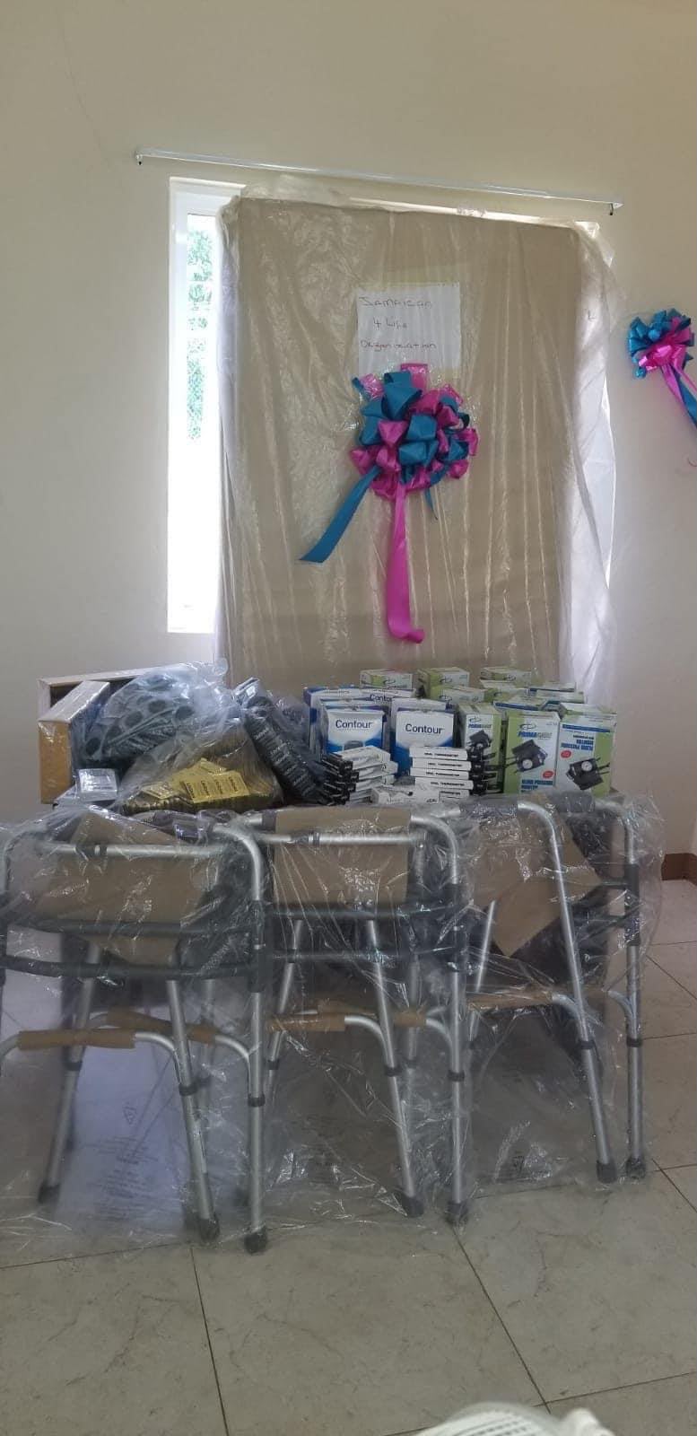 Stacked walkers and medical supplies with bow