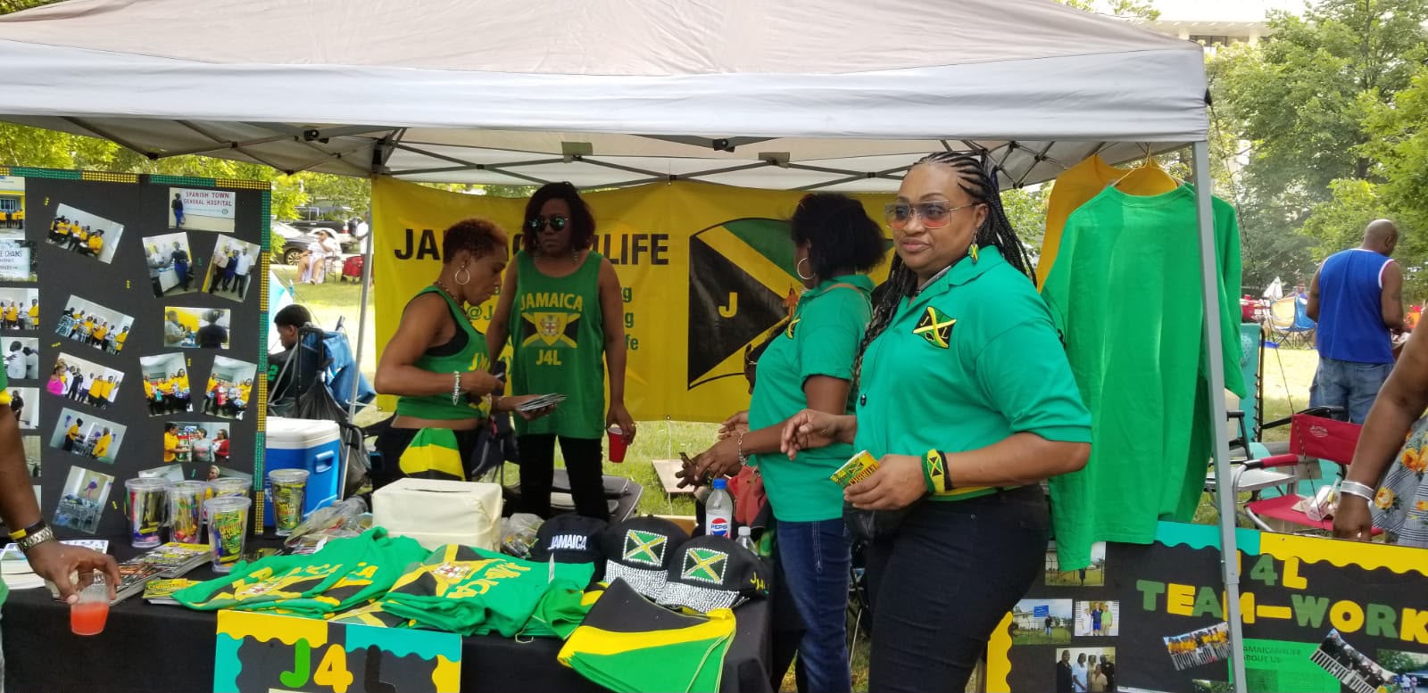 Jamaican merchandise booth with people