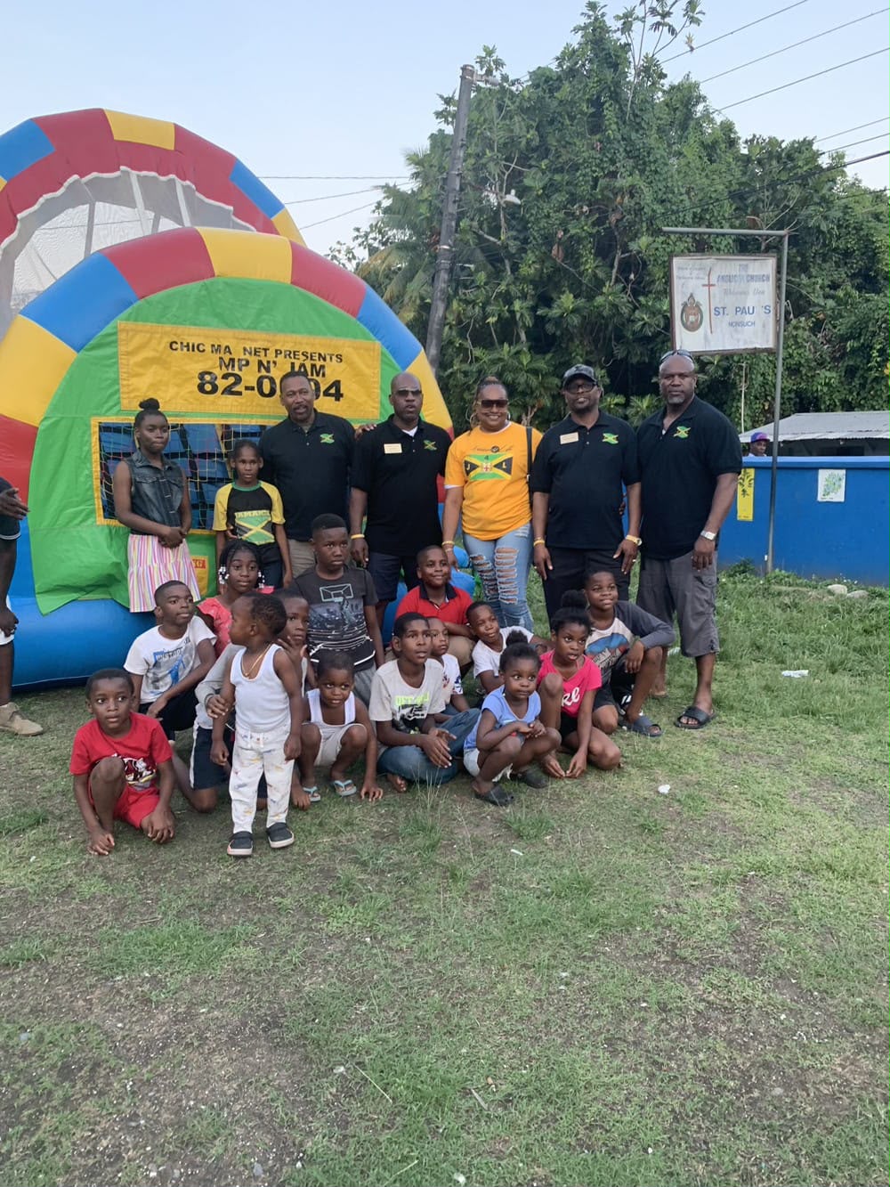 Group of children and adults by bounce house